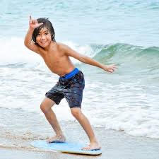 boy on skimboard