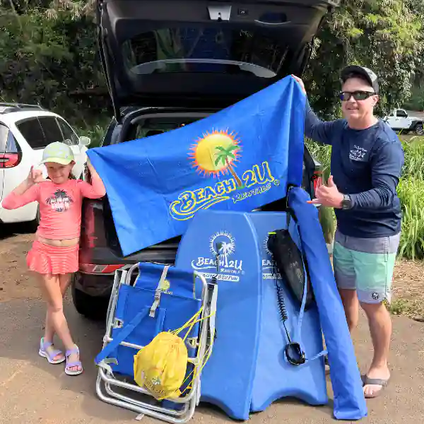 people collecting beach gear rentals, umbrella, chairs, towels, boogie board